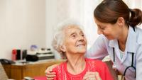 Older female patient with her caretaker